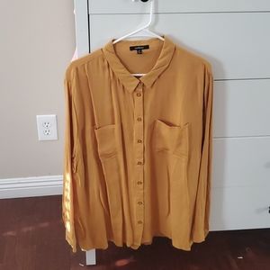 Mustard yellow long sleeve shirt.